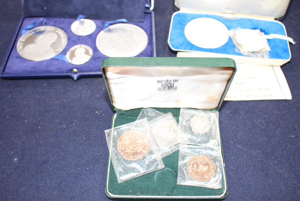 A set of the Kings and Queens of England sterling silver proof medallions, housed in original album and three other cased sets